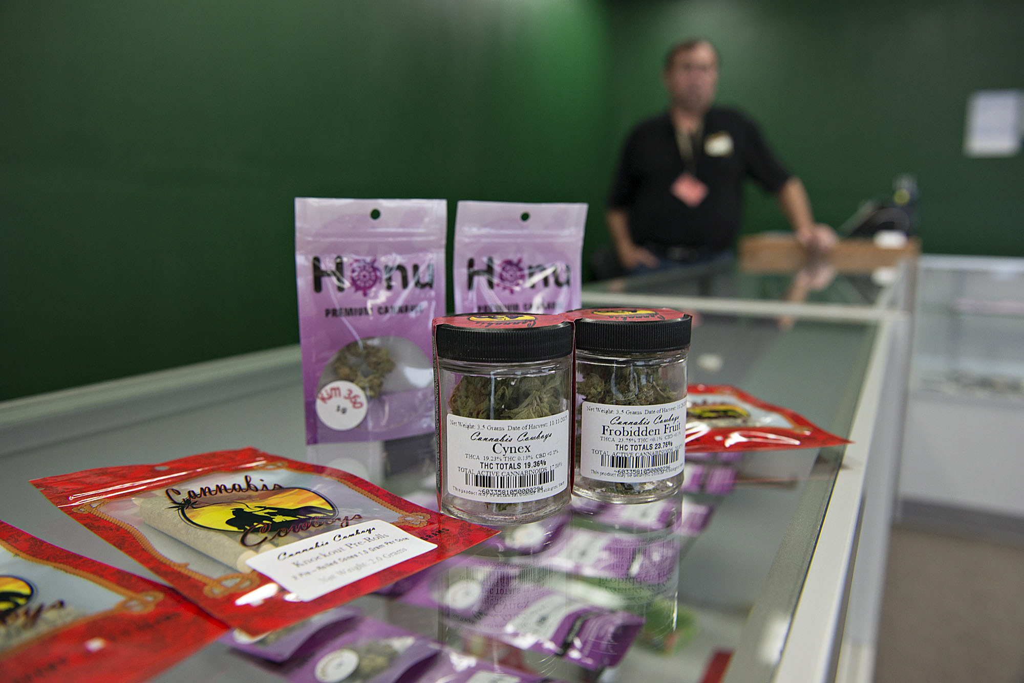 John Larson, owner of Sticky's Pot Shop, displays a variety of strains of marijuana at his shop Thursday afternoon. Larson sued Clark County over its moratorium against recreational marijuana businesses and lost in 2014. (Amanda Cowan/The Columbian)
