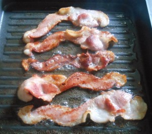 Start by frying up some thick-cut bacon until crispy.