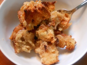 Immediately after taking the bread pudding out of the oven, drizzle maple syrup all over the top.