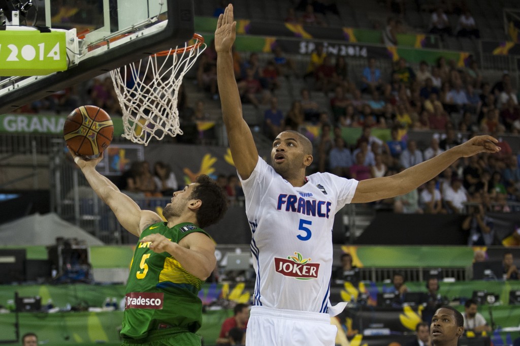 Nicolas Batum and France advance to the knockout stage. 