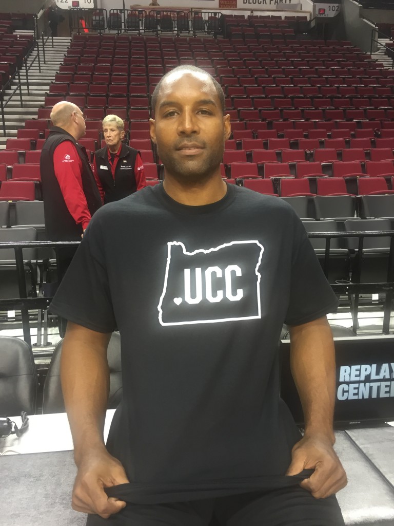 Blazers assistant David Vanterpool wearing shirt honoring victims of the UCC shooting last Thursday. 
