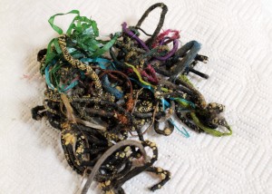 This pile of shoe laces, hair rubber bands and more measures about 5" across and is the size of your fist. This was surgically removed from a cat's stomach. Left untreated a cat can die from the obstruction.