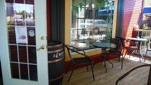 DJ's porch is an inviting space to enjoy a leisurely lunch and a glass of wine from Dee's local selection
