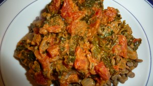 African-Style stewed kale tastes better than it looks but the bright red from the tomatoes and deep green from the kale says 'packed with nutrients and flavor' all on its own