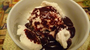 Mom's Hot Fudge spooned over vanilla ice cream-the heat of the fudge melting the ice cream...yummy goodness.