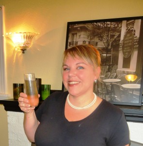 Keri Gallagher, owner of C'est La Vie, showing off the Provence, an elegant mimosa made with a Spanish Cava and lavender