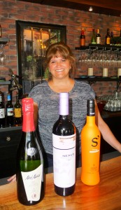 Mar Meyerhoefer, Madrid native and co-owner of Emanar Cellars, with a selection of their top-selling Spanish wines