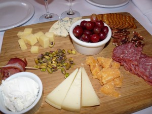 The ample cheese plate, stocked with fruits, nuts and five different cheeses, is an ideal food-pairing choice for an afternoon of wine tasting.