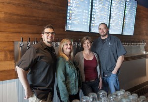 Owners of the recently-opened Vancouver tap room Grapes 'n Growlers (L to R) Ashley Cahoon, Amanda Barnett Cahoon, Paige Mahoney, and Tom Mahoney. (Natalie Behring/The Columbian)