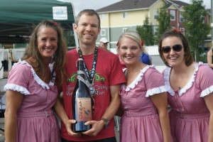 Olequa Cellars has been donating a larger-than-Magnum-sized bottle of wine (technically a Marie-Jeanne) every year to the first place male winner and first place female winner of the half marathon. Justin Ashworth was the proud recipient for 2014. Photo courtesy of Get BOLD Events. 