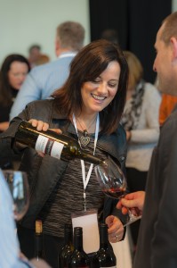 Annette Bergevin, with her signature inviting smile, pours a sampling of Bergevin Lane Vineyards 2011 Moonspell Cabernet Sauvignon. Photo courtesy of Walla Walla Valley Wine Alliance/Richard Duval Images.