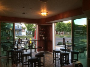 Large sliding glass doors bring the outside in at Emanar Cellars; an authentic tapas and Spanish wine bar in the heart of Battle Ground. Emanar Cellars