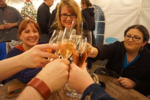 Sarah Flury, co-owner of Latte da Coffee House and Wine Bar, toasting with friends at last Thursday’s Bubbles and Beyond event. Viki Eierdam 