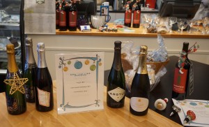 Bleu Door Bakery is absolutely shimmering with sparkling gift sets, bubbles by the bottle, a featured Isenhower Holiday Paintbrush red wine and Christmasy bottle stoppers. Viki Eierdam 