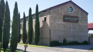 A cypress-lined drive that gives way to a terra cotta-adorned winery and tasting room are just a few authentic flairs awaiting visitors of Alloro Vineyard. Dan Eierdam
