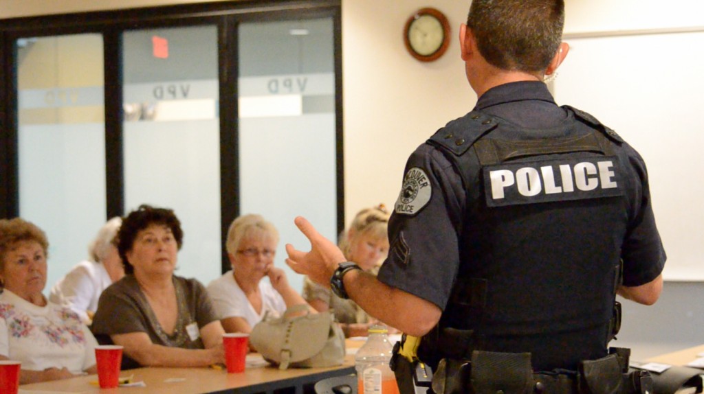 Vancouver police Cpl. Duane Boynton talks with residents at a Meadow Homes neighborhood association meeting in July.