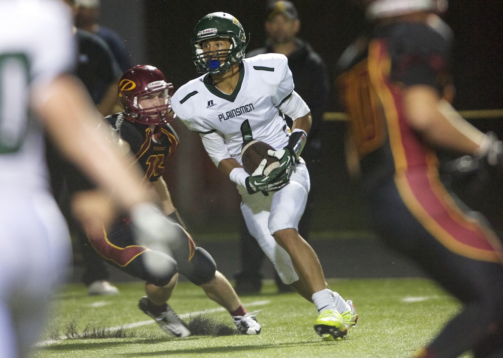 Evergreen's Justice Murphy converts a two-point conversion to put the Plainsmen up 29-20 over Prairie late in the fourth quarter at District Stadium on Friday September 20, 2013. (Zachary Kaufman/The Columbian)