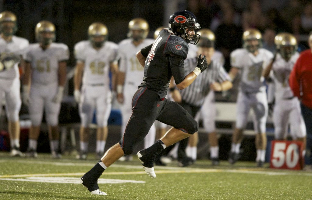 Camas' Dylan White returns an interception for a touchdown against Jesuit at Doc Harris Stadium, Friday, September 6, 2013. (Steven Lane/The Columbian)