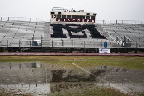 Nov. 22, 2013 - The McClintock High football field gathers water (Azcentralsports photo)