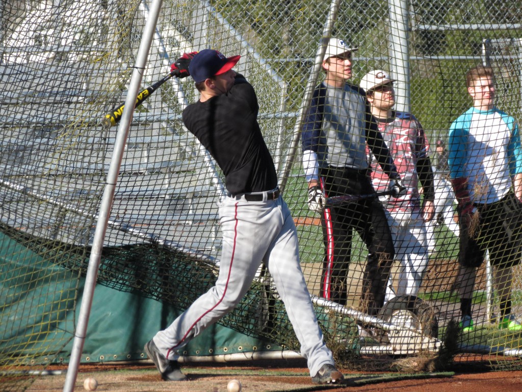 Dylan White drills a pitch into the outfield, while Reilly Hennessey and Tyler Hows keep an eye on the action. These three Papermakers will be key hitters for the Camas baseball team this spring.