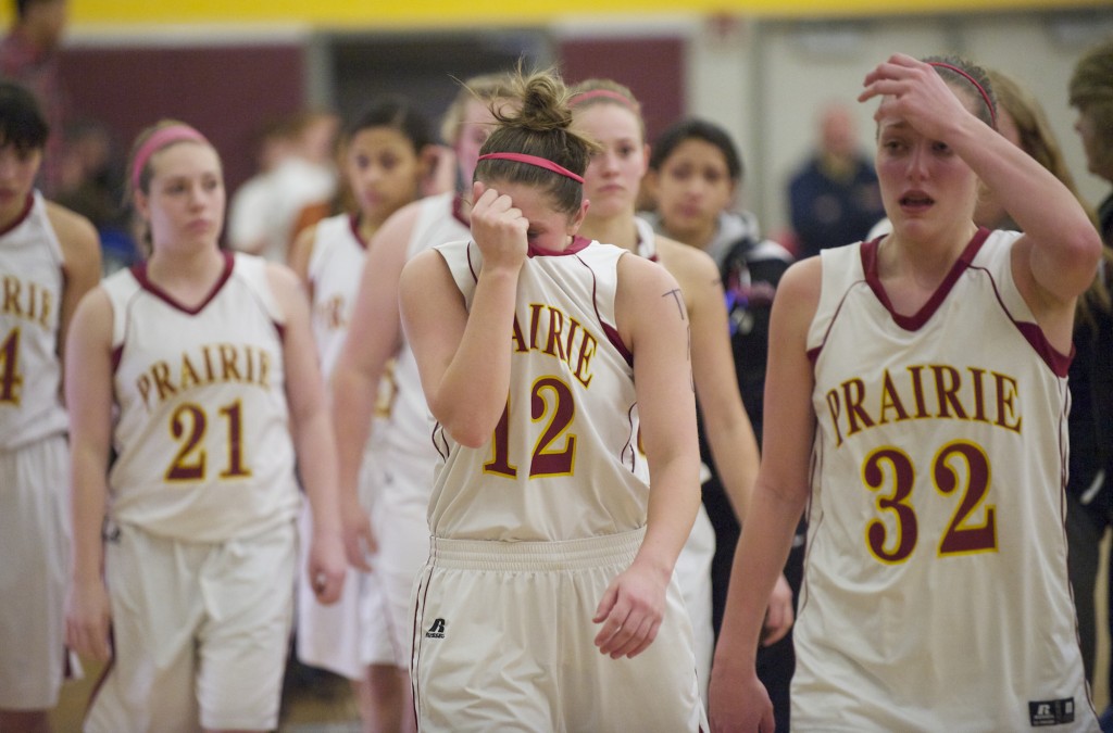 Prairie's Cori Woodward, 12, leads her team from the court after loosing to Bellevue  58-51 in the 3A Girls Regional Basketball Tournament at Mt. Tahoma High School, Friday, February 22. 2013. (Steven Lane/The Columbian)
