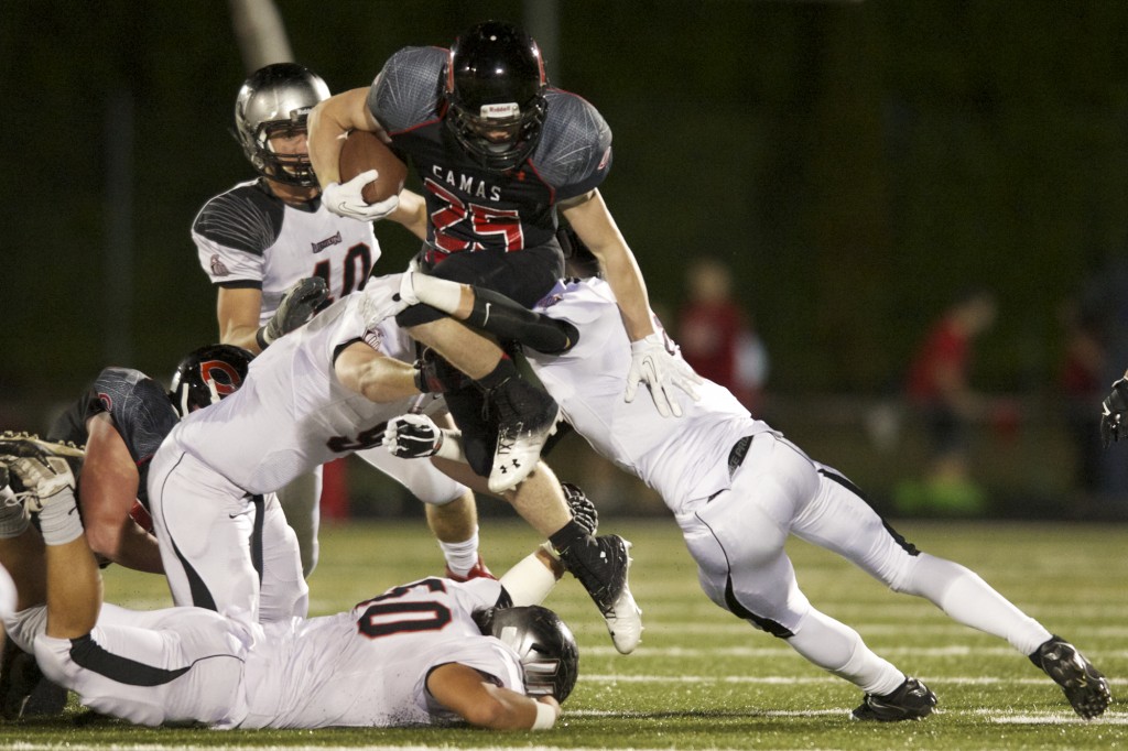 Camas running back Cole Zarcone carries the ball against Union at Doc Harris Stadium, Friday, October 18, 2013. (Steven Lane/The Columbian)