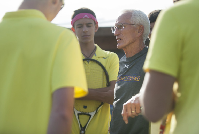 Columbia River coach Jim Chapman talks to players before a tennis match on Wednesday, Oct. 14, 2015, against Prairie. After 29 seasons of coaching wrestling, football and tennis, Chapman is retiring. (Natalie Behring/The Columbian)