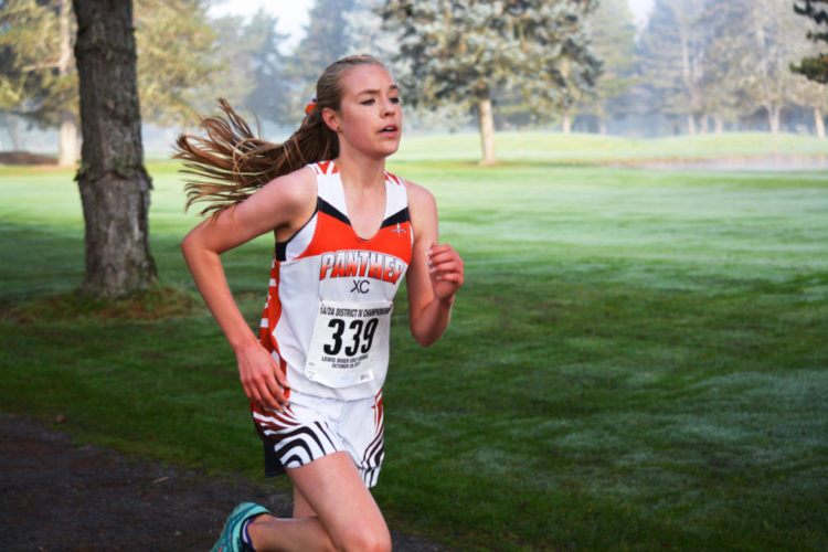 Amelia Pullen ran away with the district championship for the Washougal girls cross country team Saturday, on the Lewis River Golf Course in Woodland. She won with a time of 18:30 and broke the course record by 50 seconds.