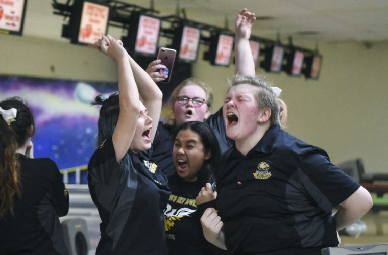 Hudson’s Bay’s girls bowling team celebrate after learning their team took second place in 3A division of the district girls bowling tournaments at Allen's Crosley Lanes in Vancouver, Friday January 26, 2018. (Ariane Kunze/The Columbian)