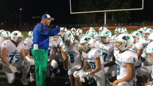 Mountain View head football coach Adam Mathieson talks to his players after the Thunder's 54-7 victory Friday over Juanita in Kirkland.