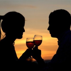 couple with wine and sunset