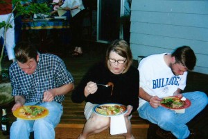 John, Janet and Ruben Cleaveland tuck into chiles rellenos at the Freemans' last potluck in 2004. 