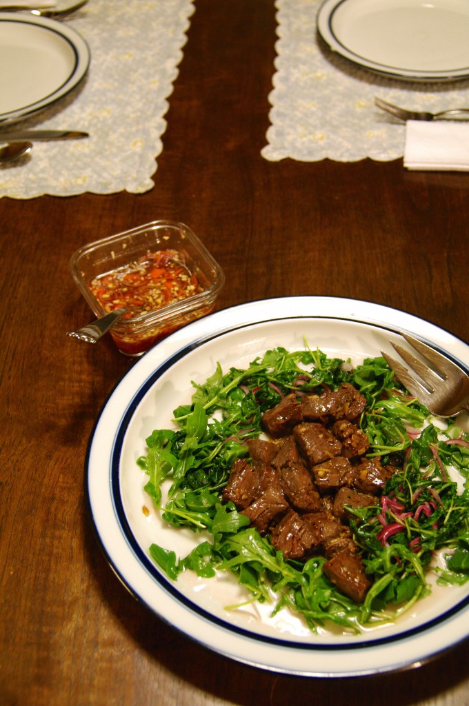 Here's Nancie McDermott's take on shaking beef, a delicious combination of watercress, red onions and tender steak. I used peppery arugula instead of the watercress. 
