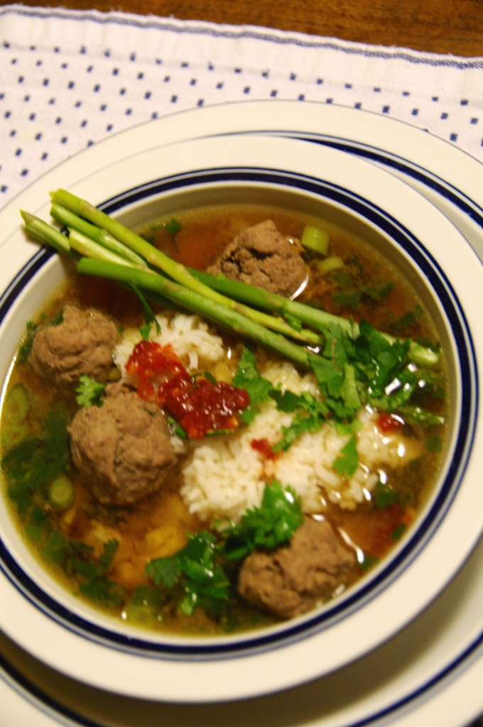 You can adjust the heat on Nancie McDermott's Vietnamese meatball soup by adding more chili-garlic sauce. We also added asparagus on the side.