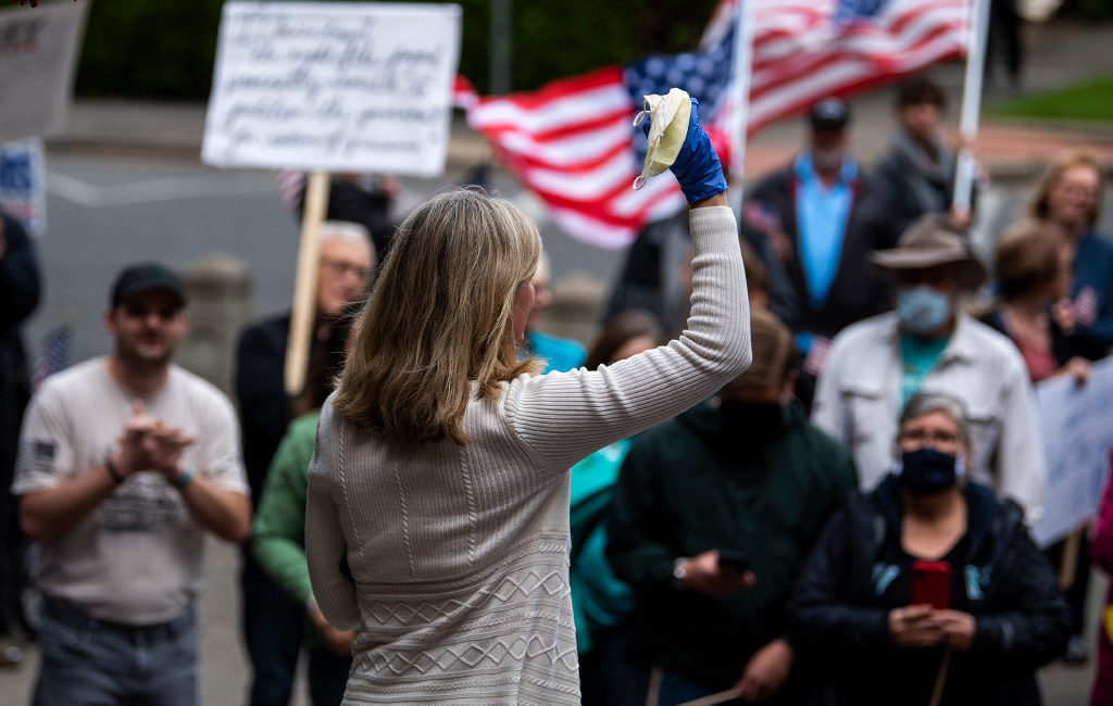 State Rep. Vicki Kraft, R-Vancouver, speaks to a crowd gathered in front of Clark County Superior Court to protest Washington Governor Jay Inslee's extension of coronavirus stay-at-home order in Vancouver on May 1, 2020. (Alisha Jucevic/The Columbian)